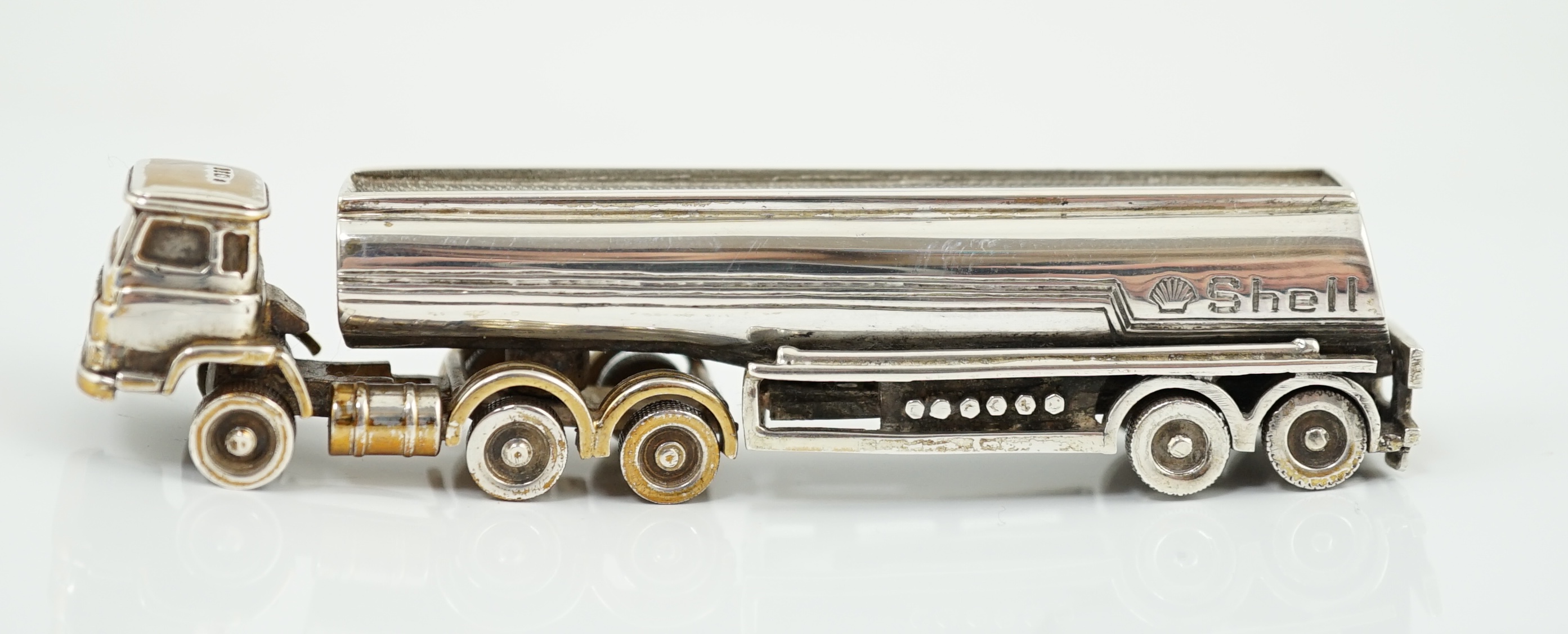 An Elizabeth II parcel gilt silver miniature model of a Shell oil tanker, by Theo Fennell